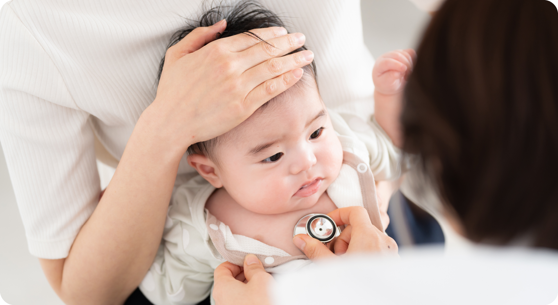 Baby with ECG stickers on chest